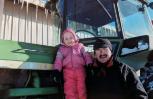 Dad and daughter on tractor