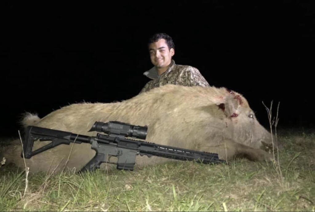 Houston used a thermal to hunt a hog at night.